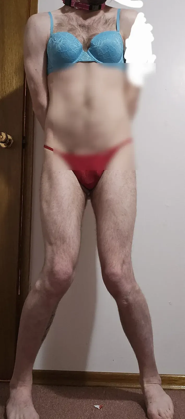 Adult in underwear standing indoors by a door, suitable for a page about privacy and consent in adult dating
